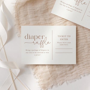 May include: Two white cards with brown text that reads "diaper raffle" and "Bring a package of diapers in any size to be entered to win a prize!" and "TICKET TO ENTER. Please write your name here."
