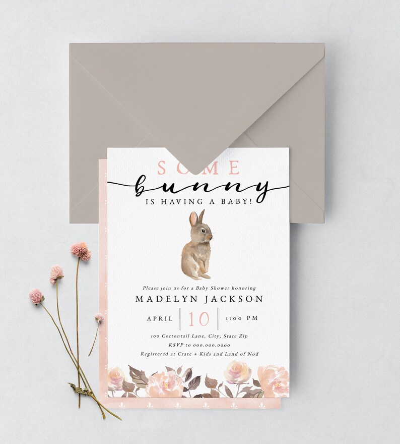 May include: A baby shower invitation with a pink and white floral design. The invitation features a watercolor illustration of a brown bunny and the text "Some bunny is having a baby!"  The invitation is for Madelyn Jackson and is scheduled for April 10th at 1:00 PM. The address is 100 Cottontail Lane, City, State Zip. RSVP to 000.000.0000. Registered at Crate & Kids and Land of Nod.