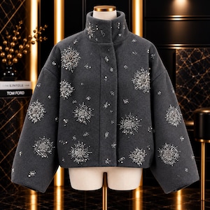 May include: A charcoal grey cropped jacket with a high collar, featuring scattered starburst-shaped embellishments made of silver beads, crystals, and small white pearls across the front and sleeves, with a concealed front button closure.