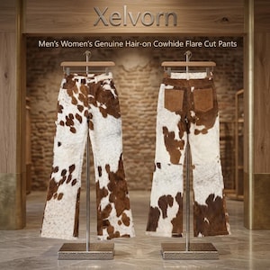 May include: Two pairs of flare cut trousers made of genuine hair-on cowhide with a brown and white spotted pattern. The trousers are displayed on wooden hangers on metal stands. The text Xelvorn and Men's Women's Genuine Hair-on Cowhide Flare Cut Pants is visible.