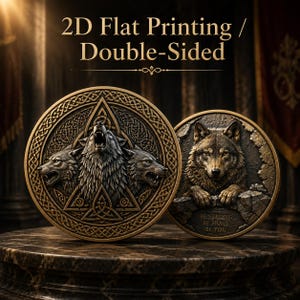 May include: Two circular bronze-toned plaques with 2D flat printing and double-sided design. The left plaque features three wolf heads within a triangular knotwork border. The right plaque shows a wolf emerging from stone with the text BE STRONG BE BRAVE BE YOU.