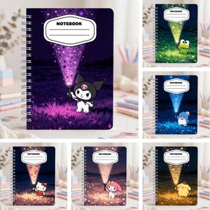 May include: A collection of six spiral-bound notebooks featuring Sanrio characters holding flashlights that project light beams onto a label with the word NOTEBOOK. Each cover displays a unique character, including Kuromi, Keroppi, Tuxedosam, Hello Kitty, My Melody, and Pompompurin, set against dark, starry night landscapes.