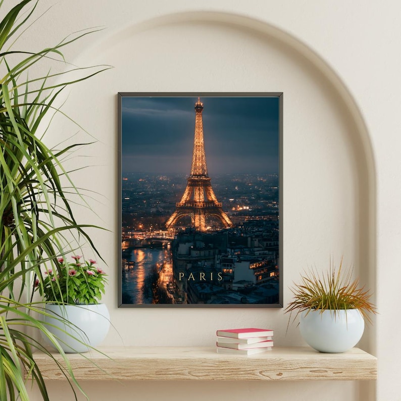 May include: A rectangular wall art print featuring a night view of the Eiffel Tower in Paris, illuminated with warm golden lights against a dark blue twilight sky, with the word PARIS printed in gold capital letters at the bottom centre.