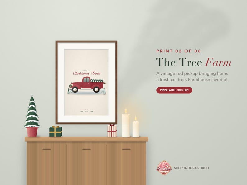 May include: A framed wall art print featuring a red vintage pickup truck carrying a green Christmas tree, with the text "Christmas Trees" and "The Tree Farm" displayed on a cream background, presented in a dark brown wooden frame.