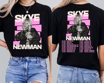 May include: A black short-sleeve t-shirt featuring a graphic of Skye Newman. The front displays the name Skye Newman with a black and white photo of the artist. The back lists tour dates and locations in the UK and Australia in white text.