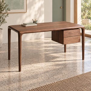 May include: A dark brown wooden desk featuring a rectangular top with rounded edges and four tapered legs. The desk includes a suspended storage unit on the right side, consisting of two stacked drawers with a smooth, grain-patterned wood finish.