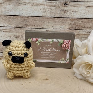 Amigurumi, crocheted pocket- sized pug, stuffed animal, plushy