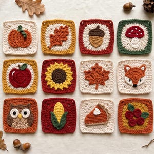 May include: A collection of twelve square crochet appliques featuring autumn-themed designs including a pumpkin, oak leaf, acorn, mushroom, apple, sunflower, maple leaf, fox face, owl, corn cob, slice of pumpkin pie, and red berries.