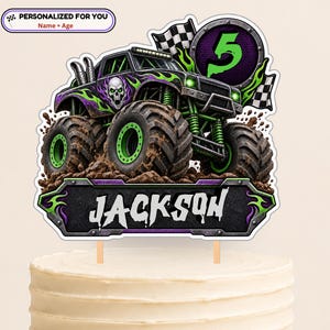 May include: A cake topper featuring a purple and black monster truck with green flames, a skull graphic, and large tires in mud. A circular badge displays the number 5, and a rectangular plaque below features the name JACKSON in white text.