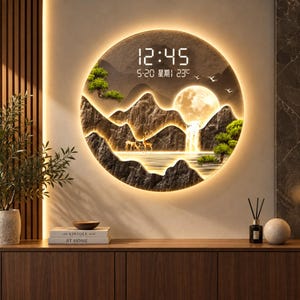 May include: A circular wall clock featuring a backlit landscape scene with mountains, a waterfall, trees, and deer. The digital display shows the time 12:45, the date 5-20, and a temperature of 23 degrees Celsius with Chinese characters.