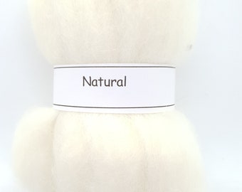 May include: A white ball of natural wool roving, labeled "Natural".