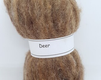 May include: A bundle of brown wool roving labeled "Deer".
