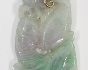 May include: A green jade pendant carved with a floral design and accented with small diamonds. The pendant is attached to a gold chain.