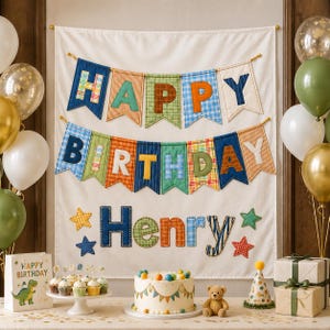 May include: A fabric wall hanging featuring the text HAPPY BIRTHDAY Henry in colorful plaid and solid fabric letters. The banner includes star accents, a cake with colorful spheres, a teddy bear, and a party hat on a table.