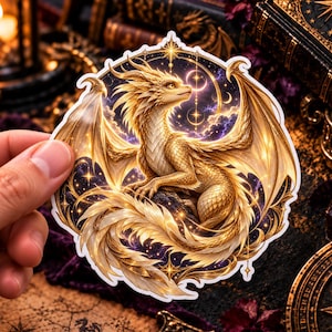 May include: A circular sticker featuring a golden dragon with intricate scales and large wings, set against a dark purple starry night sky background with glowing celestial elements, including a bright star and crescent moon, all within a decorative border.