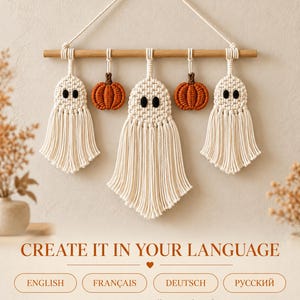 May include: A macrame wall hanging featuring three off-white ghosts and two orange pumpkins suspended from a wooden dowel with a hanging cord. Text reads: CREATE IT IN YOUR LANGUAGE, ENGLISH, FRANÇAIS, DEUTSCH, РУССКИЙ, 8 pages per PDF, Illustrated guide.