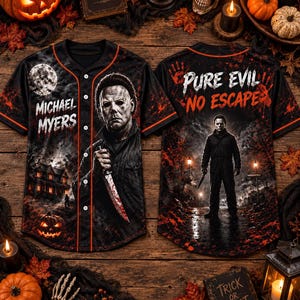 May include: A black baseball jersey featuring a graphic print of Michael Myers holding a knife, a full moon, and a house. The back displays the text PURE EVIL NO ESCAPE and a full-body image of Michael Myers. The shirt has orange piping details.