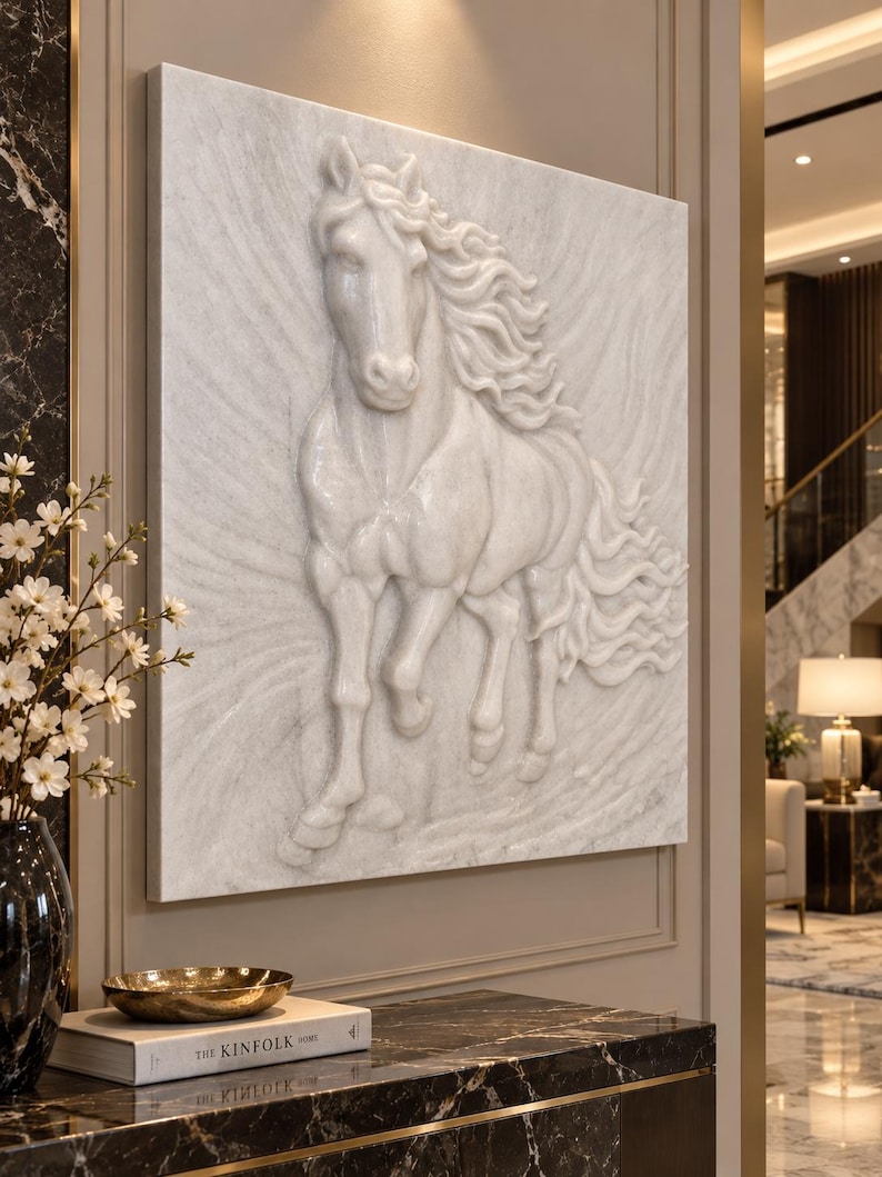 May include: A square white wall art piece featuring a high-relief sculpture of a horse in motion. The horse is depicted with a flowing mane and tail, carved from a smooth, light-coloured material that creates a three-dimensional effect on the surface.