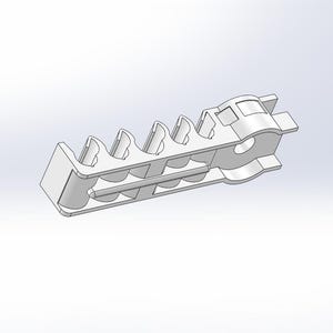 May include: A white, elongated, rigid plastic component featuring a series of five evenly spaced, curved, open-top slots along its length, with a circular aperture at one end and a small, protruding tab at the opposite end of the structure.