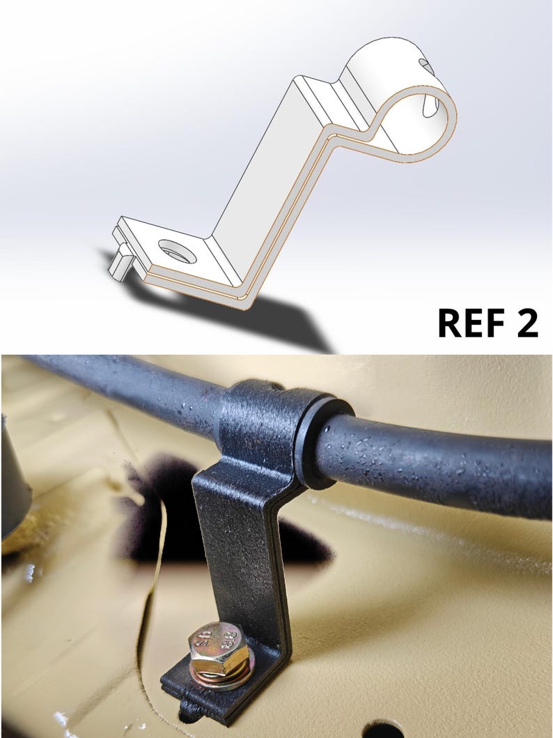 May include: A black metal Z-shaped mounting bracket with a circular clamp at one end and a flat base with a bolt hole at the other. The bracket is secured to a tan surface with a silver hex bolt. The text REF 2 appears in the upper right corner.