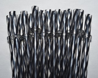 May include: A collection of clear, reusable drinking straws with a black and silver spiral design. The straws are made of a durable material and are suitable for various beverages. The image shows a close-up of the straws.