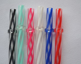 May include: A collection of colorful, reusable drinking straws. Each straw features a clear body with a spiraling design in various colors, including black, teal, pink, white, blue, and red. The straws have a clear ring near the top.