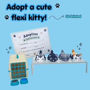 May include: Four small 3D printed articulated cat figurines in various colours, a beige pet carrier with a blue door, two small bowls, and an adoption certificate document with the text Adopt a cute flexi kitty and 3D Printed.