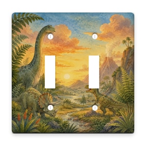 May include: A double light switch cover featuring a prehistoric landscape with a long-necked sauropod, a triceratops, and a theropod dinosaur. The scene includes a river, lush ferns, a smoking volcano, and a golden sunset sky with orange clouds.