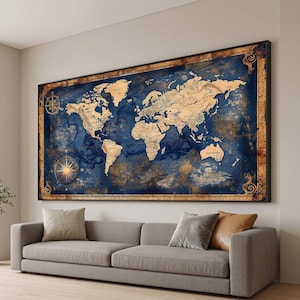 May include: A large rectangular wall art piece featuring a detailed world map in shades of deep navy blue and aged parchment tan. The map includes decorative compass roses on the left side and is enclosed within an ornate, weathered gold border.