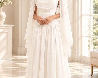 Abito lungo avorio, elegante abito a maniche lunghe con mantellina drappeggiata.
