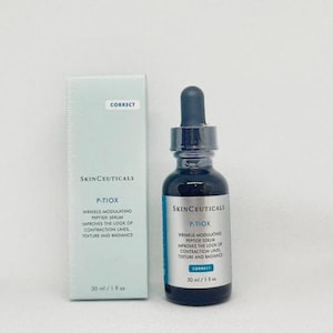 May include: A SkinCeuticals P-TIOX wrinkle-modulating peptide serum bottle and its light blue cardboard box. The dark glass bottle features a black dropper cap and a silver label. Both items display the text 30 ml / 1 fl oz and Correct.