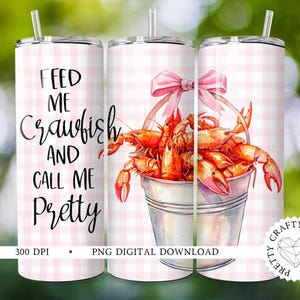 May include: A pink and white checkered tumbler with the text "Feed me crawfish and call me pretty". The tumbler has a design of a bucket of crawfish with a pink bow.