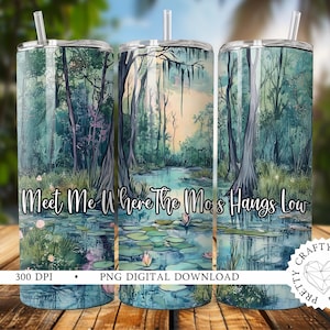 May include: A set of three sublimation tumblers with a watercolor design of a swamp scene. The design features trees, water, and the text "Meet Me Where The Moss Hangs Low".