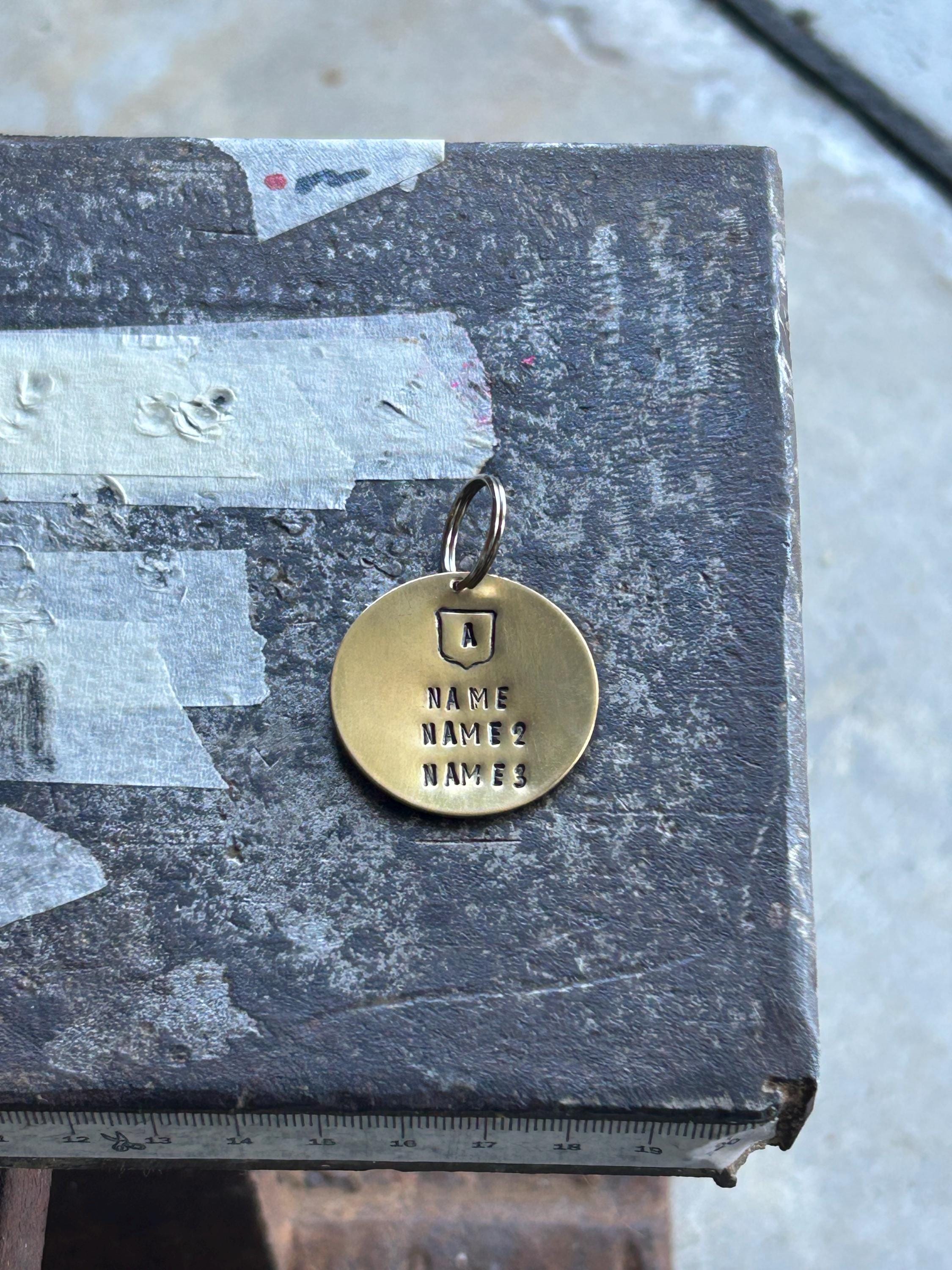 Personalized Brass Family Crest Keyring, Hand Stamped Surname Initial Shield (35mm), photograph 2