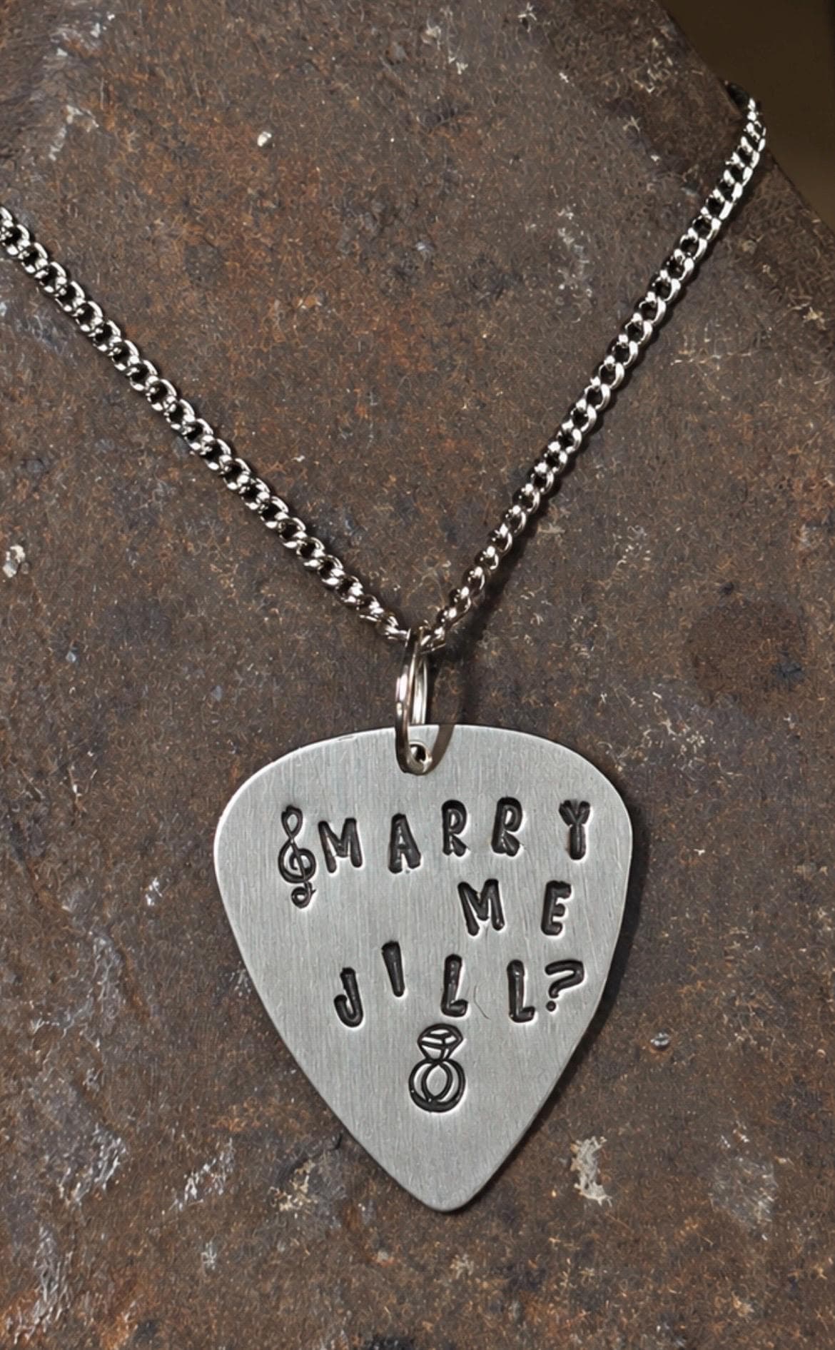 Personalised Guitar Pick Pendant Necklace | Hand-Stamped Proposal Gift (Alkeme Metal), photograph 1