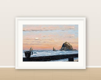 May include: An oil painting in a white frame depicting a dark mug resting on a dark railing overlooking a turbulent ocean at sunset. Large rock formations rise from the water under a sky filled with soft pink, orange, and blue clouds.