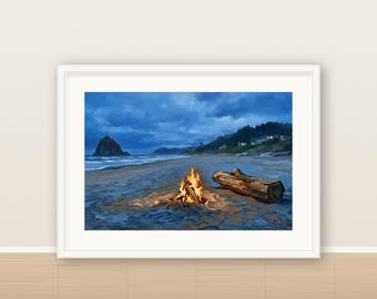 May include: A framed landscape print depicting a beach at twilight with a bright orange campfire burning in the sand. A large piece of driftwood lies nearby, with a dark sea, a rocky monolith, and a distant coastline visible under a blue sky.