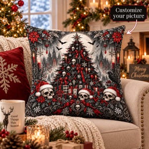 May include: A square throw pillow featuring a gothic Christmas tree illustration with skulls, red bows, poinsettias, and bats. The design includes a full moon, wrapped gifts, and three skulls wearing Santa hats at the base. The text reads Customize your picture.