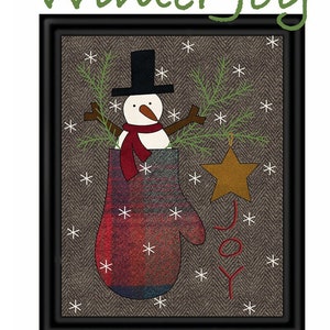 May include: A framed illustration of a snowman wearing a black top hat and red scarf, standing in a red mitten with a green pine branch and a gold star ornament. The background is a brown and white herringbone pattern with the text "Winter Joy" above the image and "Joy" below the snowman.