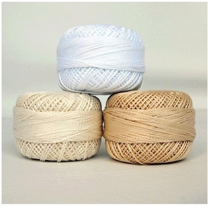 May include: Three spools of thread, one white, one beige, and one brown.