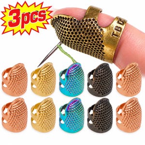 May include: A set of open-sided sewing thimbles featuring a textured, dimpled surface for needle grip. The collection includes various metallic finishes such as antique brass, gold, copper, black, and iridescent rainbow, all designed for finger wear.