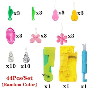 May include: A 44-piece sewing tool set featuring various needle threaders in green, pink, and yellow, including butterfly and flower shapes, alongside metallic silver threaders, two plastic automatic threader devices, and a blue seam ripper tool.