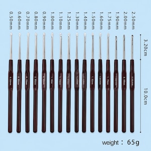 May include: A set of sixteen crochet hooks with dark brown handles and silver metal tips, ranging in size from 0.50mm to 2.50mm. Each hook is labeled with its specific size. The total length of the hook section is 3.20cm, total length 10.0cm, weight 65g.