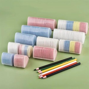 May include: A collection of triangular plastic cases containing stacks of thin, colorful adhesive index tabs in shades of pink, blue, white, and yellow, accompanied by five sharpened pencils in black, green, yellow, white, and dark blue.