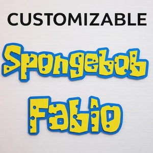 May include: A customisable sign featuring the word Spongebob and the name Fabio in a yellow, cheese-like font with blue outlines. The text is displayed in two separate lines against a plain background, with the word CUSTOMISABLE printed above.