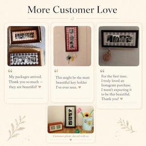 May include: A collection of rectangular wooden photo frames with fabric borders in various patterns, including gingham and stripes. Some frames function as wall-mounted key holders with metal hooks, displaying multiple black and white photos.