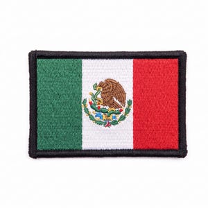 May include: A rectangular embroidered patch featuring the flag of Mexico with vertical green, white, and red stripes. The central white stripe displays the national emblem of an eagle perched on a cactus holding a snake, all bordered by black thread.