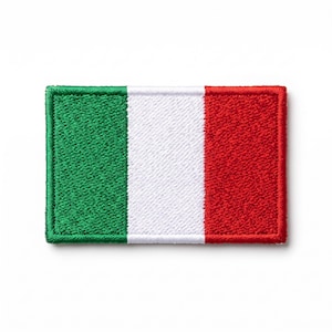 May include: A rectangular embroidered patch featuring the Italian flag design with three vertical stripes in green, white, and red. The patch has a stitched border and a textured fabric surface, showcasing the national colors of Italy in a classic style.