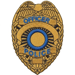 May include: An embroidered patch shaped like a shield with a gold eagle at the top. The patch features the blue text "OFFICER" and "POLICE" with a central blue ring surrounded by black rays on a gold background, framed by gold laurel leaf patterns.