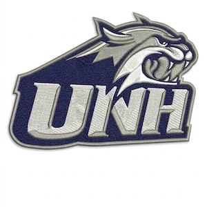 May include: An embroidered patch featuring the letters UNH in white with a dark blue outline. Above the text is a stylized silver and white wildcat head graphic with sharp teeth, all bordered by a thick silver and dark blue stitched edge.